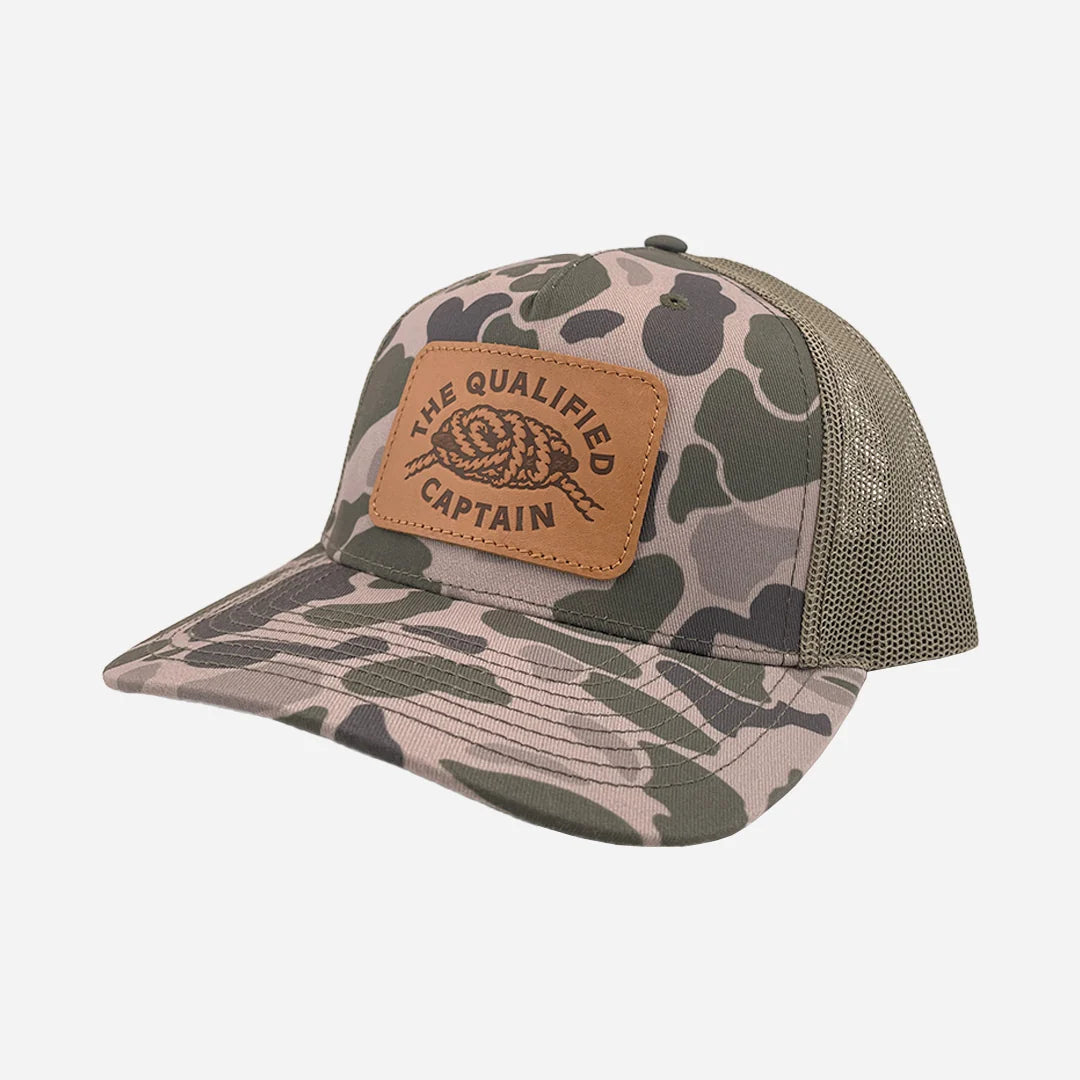 The Qualified Captain™ Tangled Up Leather Patch Trucker Hats | Color: Marsh Duck Camo/Loden
